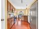 Updated kitchen with stainless steel appliances, granite countertops, and a view of the dining area at 15329 Smithfield Dr, Westfield, IN 46074