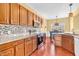 Gourmet kitchen with wooden cabinets, stainless steel appliances, and mosaic backsplash at 15329 Smithfield Dr, Westfield, IN 46074