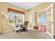 Home office space with natural light, a desk, and French doors at 15329 Smithfield Dr, Westfield, IN 46074