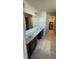 Bathroom featuring double sink vanity with a large mirror and walk-in closet at 15406 Forest Glade Dr, Fishers, IN 46037
