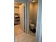 View into a bathroom with toilet and open closet with shelving for organizing items at 15406 Forest Glade Dr, Fishers, IN 46037