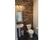 Stylish bathroom featuring accent wood wall and modern fixtures at 15406 Forest Glade Dr, Fishers, IN 46037