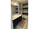 Bright bathroom featuring double vanity, a large mirror and modern tub and shower at 15406 Forest Glade Dr, Fishers, IN 46037