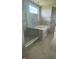 Modern bathroom with a glass-enclosed shower and a built-in soaking tub at 15406 Forest Glade Dr, Fishers, IN 46037