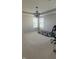 Bright bedroom with carpet flooring, a modern light fixture, and two large windows at 15406 Forest Glade Dr, Fishers, IN 46037