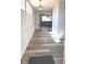 Elegant foyer featuring hardwood floors, wainscoting, and modern lighting fixtures at 15406 Forest Glade Dr, Fishers, IN 46037