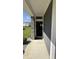View of the front entrance with stone accents and glass front door at 15406 Forest Glade Dr, Fishers, IN 46037