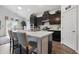 Kitchen features a modern island with seating, updated cabinetry, and stainless steel appliances at 1666 Huntzinger Blvd, Pendleton, IN 46064