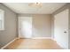 This bedroom features hardwood floors and a closet with sliding doors at 1823 E 44Th St, Anderson, IN 46013