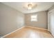 Bedroom with hardwood floors, neutral paint, and a modern ceiling fan at 1823 E 44Th St, Anderson, IN 46013