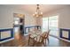 Inviting dining area with modern light fixture and sliding glass door to the backyard at 1823 E 44Th St, Anderson, IN 46013