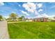 Exterior view of a brick home with a well-kept lawn and inviting curb appeal at 1823 E 44Th St, Anderson, IN 46013