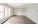 Spacious living room featuring sleek flooring, natural light, and a neutral color palette at 1823 E 44Th St, Anderson, IN 46013