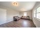 Inviting living room with wood floors, neutral walls, and two leather sofas at 1823 E 44Th St, Anderson, IN 46013