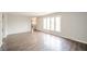 Open living space with hardwood floors, neutral walls, and plenty of natural light at 1823 E 44Th St, Anderson, IN 46013
