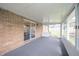 Enclosed sunroom features carpet and multiple windows for lots of natural light at 1823 E 44Th St, Anderson, IN 46013
