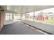 Large enclosed sunroom with carpet and lots of windows at 1823 E 44Th St, Anderson, IN 46013