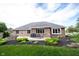 Backyard with a brick home, patio, dining set, and bay window at 1893 Water Oak Way, Avon, IN 46123