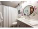 Charming bathroom with colorful floral wallpaper, updated fixtures, and modern vanity at 1893 Water Oak Way, Avon, IN 46123
