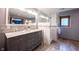 Main bathroom features dual sinks, granite countertops, and beautifully tiled shower at 1893 Water Oak Way, Avon, IN 46123