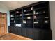 This home features a large built-in bookcase with storage and decorative molding at 1893 Water Oak Way, Avon, IN 46123