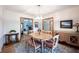 Open dining room with chandelier and hardwood floors is great for entertaining guests at 1893 Water Oak Way, Avon, IN 46123