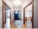 Inviting entryway featuring hardwood floors, a stylish light fixture, and access to multiple rooms at 1893 Water Oak Way, Avon, IN 46123