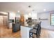 Open concept kitchen with large island and bar stool seating at 1893 Water Oak Way, Avon, IN 46123