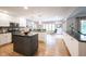 Spacious kitchen features two islands, granite countertops, and white cabinetry throughout at 1893 Water Oak Way, Avon, IN 46123