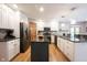 Updated kitchen featuring stainless appliances, island, and granite counters at 1893 Water Oak Way, Avon, IN 46123