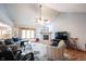Cozy living room features a stone fireplace, vaulted ceilings, hardwood floors, and a large window at 1893 Water Oak Way, Avon, IN 46123