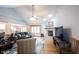 Spacious living room featuring a stone fireplace, vaulted ceilings, and large windows for natural light at 1893 Water Oak Way, Avon, IN 46123