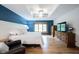 Tranquil primary bedroom with tray ceilings, board and batten accent wall, and hardwood floors at 1893 Water Oak Way, Avon, IN 46123