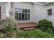 Landscaped backyard with a wooden deck that provides an inviting outdoor living and entertaining space at 1920 E 81St St, Indianapolis, IN 46240