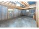Unfinished basement with exposed ceiling, framed walls, and natural light via two windows at 1920 E 81St St, Indianapolis, IN 46240