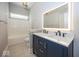 Bathroom boasting double sinks, ample counter space, tiled floors and bright, vanity lighting at 1920 E 81St St, Indianapolis, IN 46240