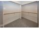 Spacious walk-in closet with carpeted floors and multiple rods and shelves for ample storage at 1920 E 81St St, Indianapolis, IN 46240
