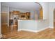 Bright kitchen boasts a breakfast bar, stainless steel appliances and hardwood flooring at 1920 E 81St St, Indianapolis, IN 46240