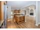 Kitchen with stainless steel appliances and wooden cabinetry, island, and open floorplan at 1920 E 81St St, Indianapolis, IN 46240