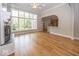 Bright open living room with large windows, fireplace, and hardwood flooring at 1920 E 81St St, Indianapolis, IN 46240