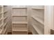 Walk-in closet with white shelving and plenty of storage space at 1920 E 81St St, Indianapolis, IN 46240