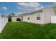 Spacious backyard with green lawn, shed, and white fence, perfect for outdoor activities at 2260 Quarter Path Rd, Cicero, IN 46034