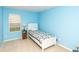 Cozy bedroom with blue walls, carpet, and a single bed at 2260 Quarter Path Rd, Cicero, IN 46034