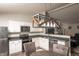 Contemporary eat-in kitchen showcasing stainless steel appliances, granite countertops, and ample cabinet space at 2260 Quarter Path Rd, Cicero, IN 46034