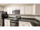 Updated kitchen featuring granite countertops, stainless steel appliances, and ample cabinet space at 2260 Quarter Path Rd, Cicero, IN 46034