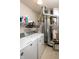 Functional laundry room with washer, dryer, storage shelves and mechanical equipment at 2260 Quarter Path Rd, Cicero, IN 46034