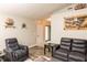 Open living room featuring neutral walls, cozy furniture, and an inviting entryway at 2260 Quarter Path Rd, Cicero, IN 46034
