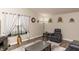 Inviting living room with wood floors, comfortable seating, and nautical decor at 2260 Quarter Path Rd, Cicero, IN 46034