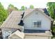 This angle shows the home's roofline, neutral siding, and window details, all contributing to curb appeal at 2277 Grand Fir Dr, Greenwood, IN 46143