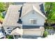 An aerial view highlighting the home's roof, two-car garage, and surrounding landscaping, situated within a community at 2277 Grand Fir Dr, Greenwood, IN 46143